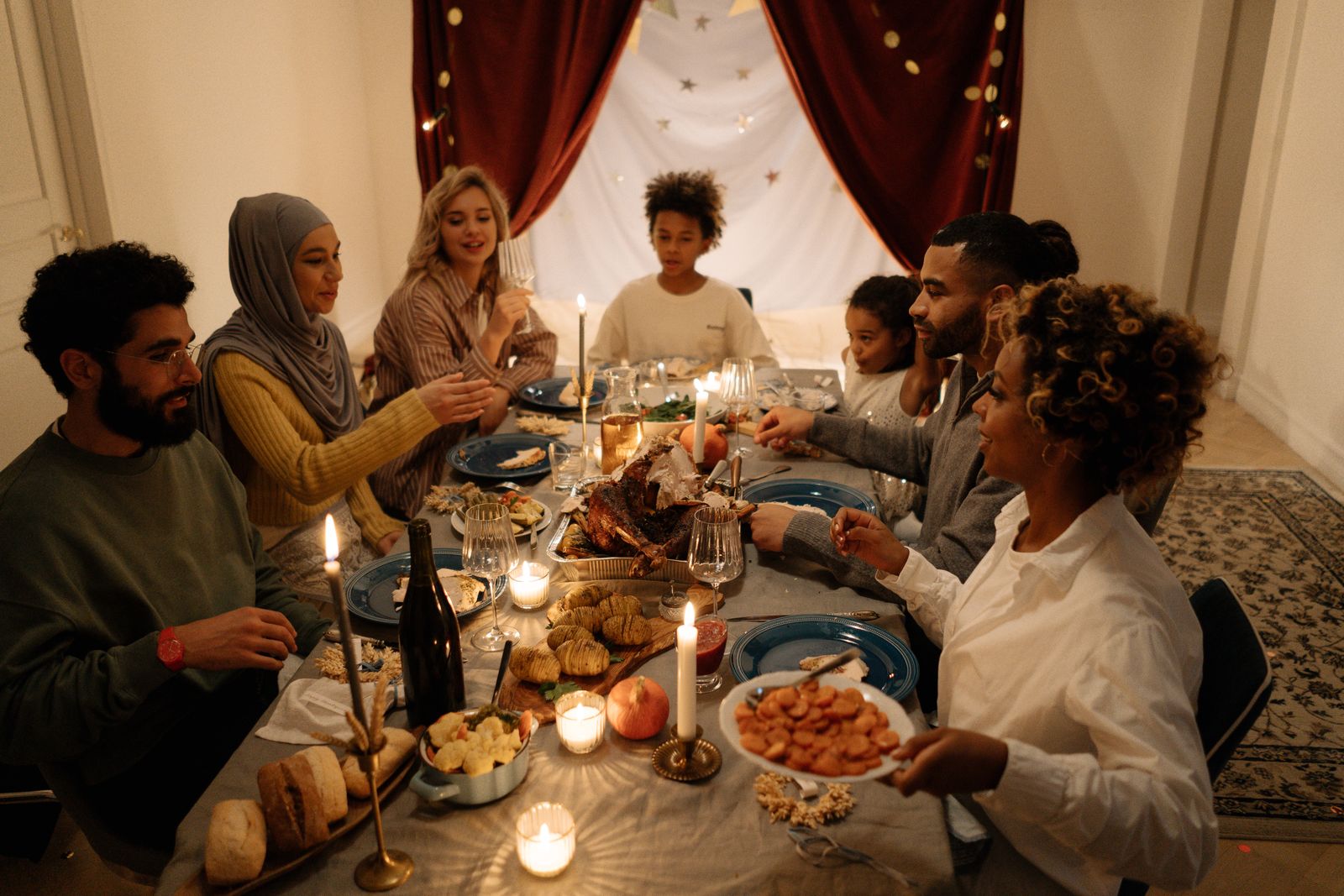 Extended family sharing a meal while a couple maintains family boundaries