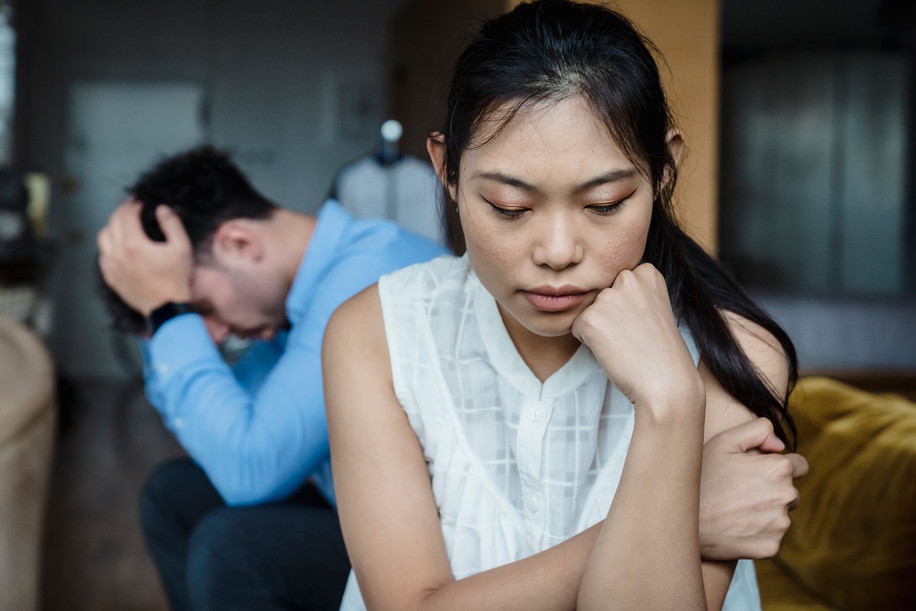 Couple sitting quietly while cooling down after a difficult argument