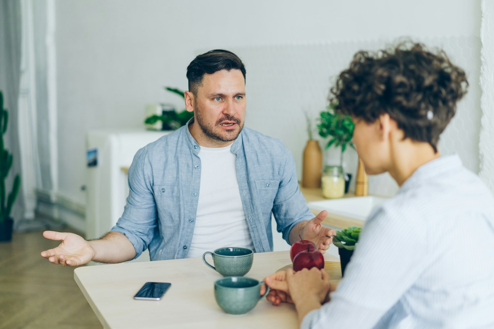Couple having a focused conversation at a table
