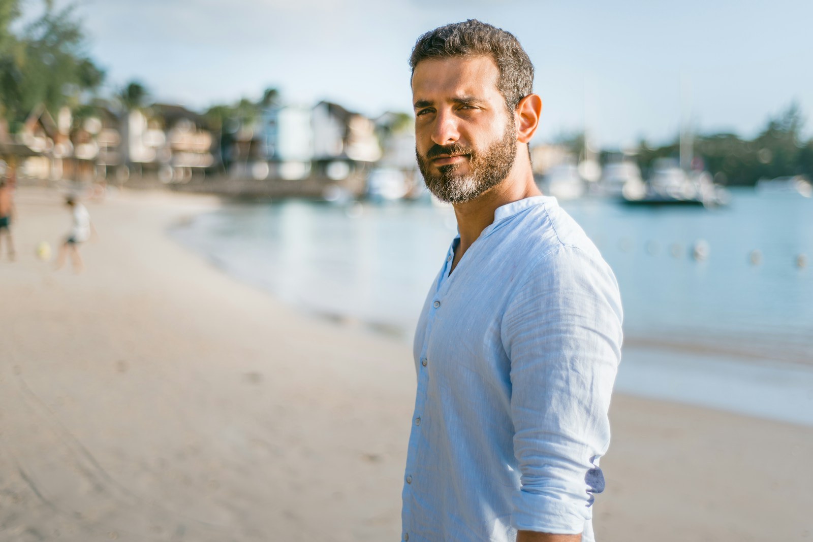 Person standing confidently outdoors without performing an alpha male persona