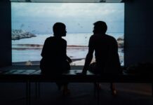 Couple sitting in silence while experiencing emotional distance