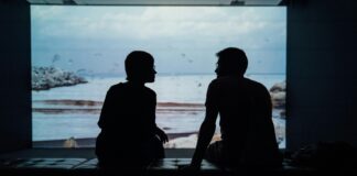 Couple sitting in silence while experiencing emotional distance