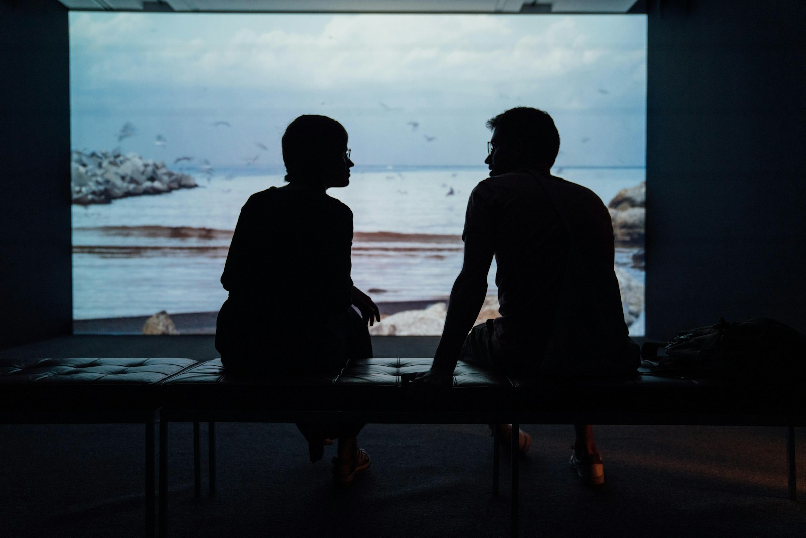 Couple sitting in silence while experiencing emotional distance