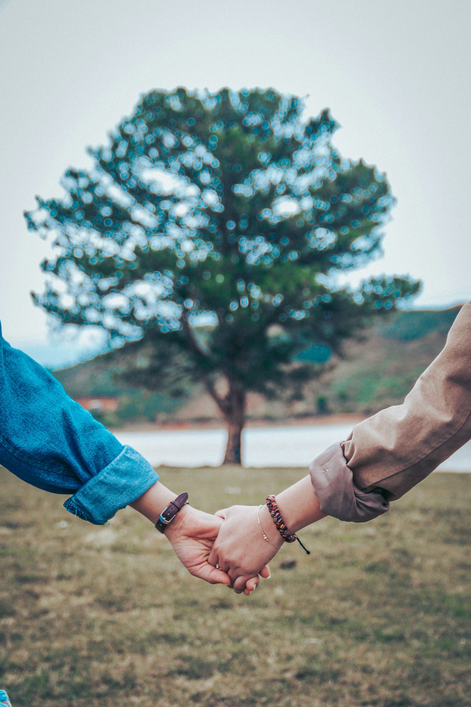 Partners holding hands while discussing commitment and relationship needs