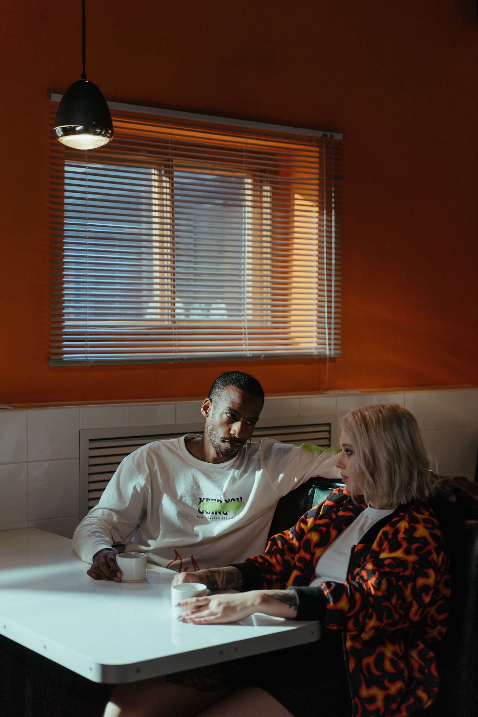 Couple having a calm conversation about family boundaries over coffee