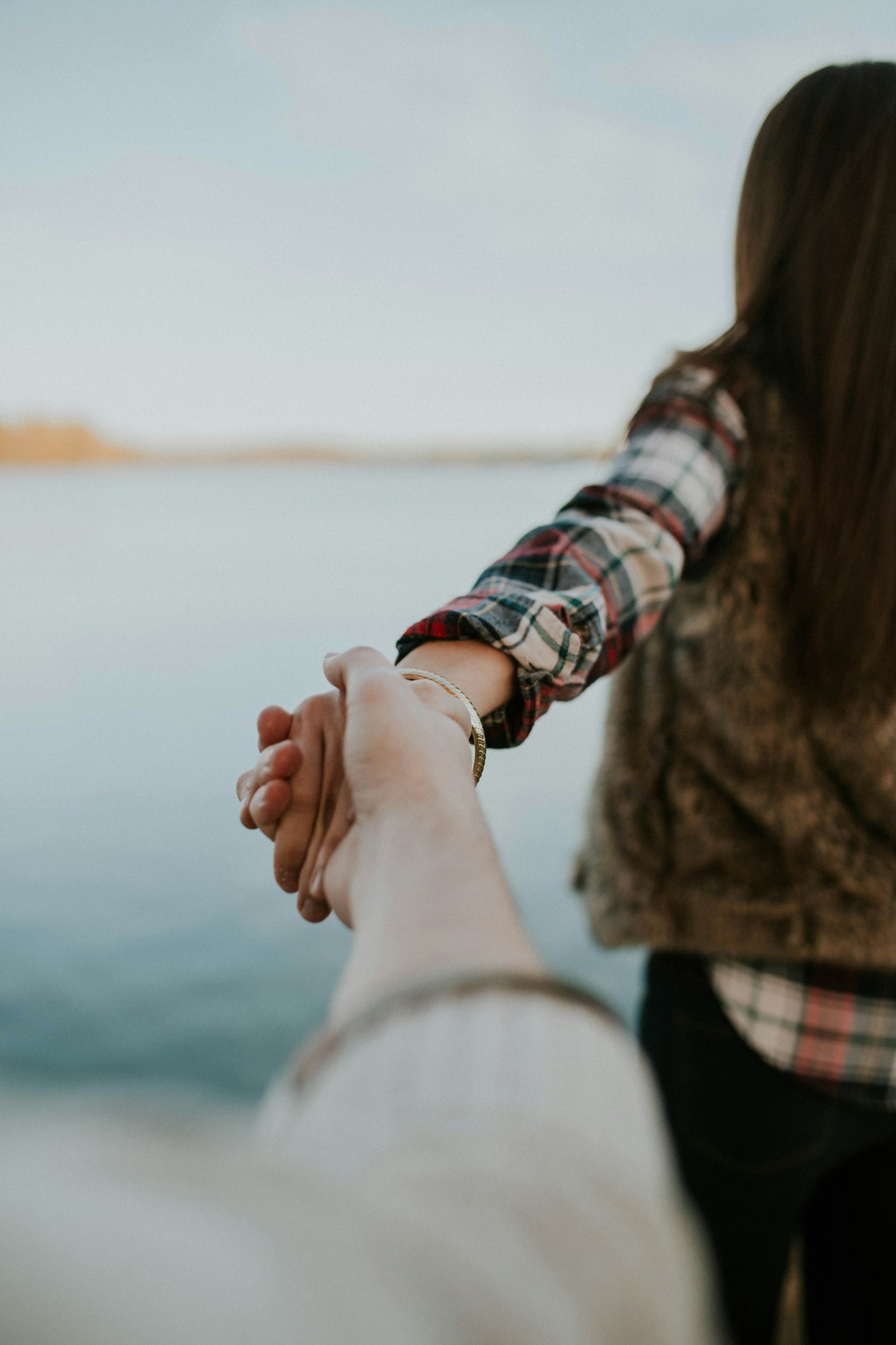 Couple holding hands as a nonverbal expression of love