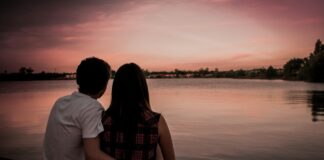 Couple sitting together while facing a difficult relationship choice