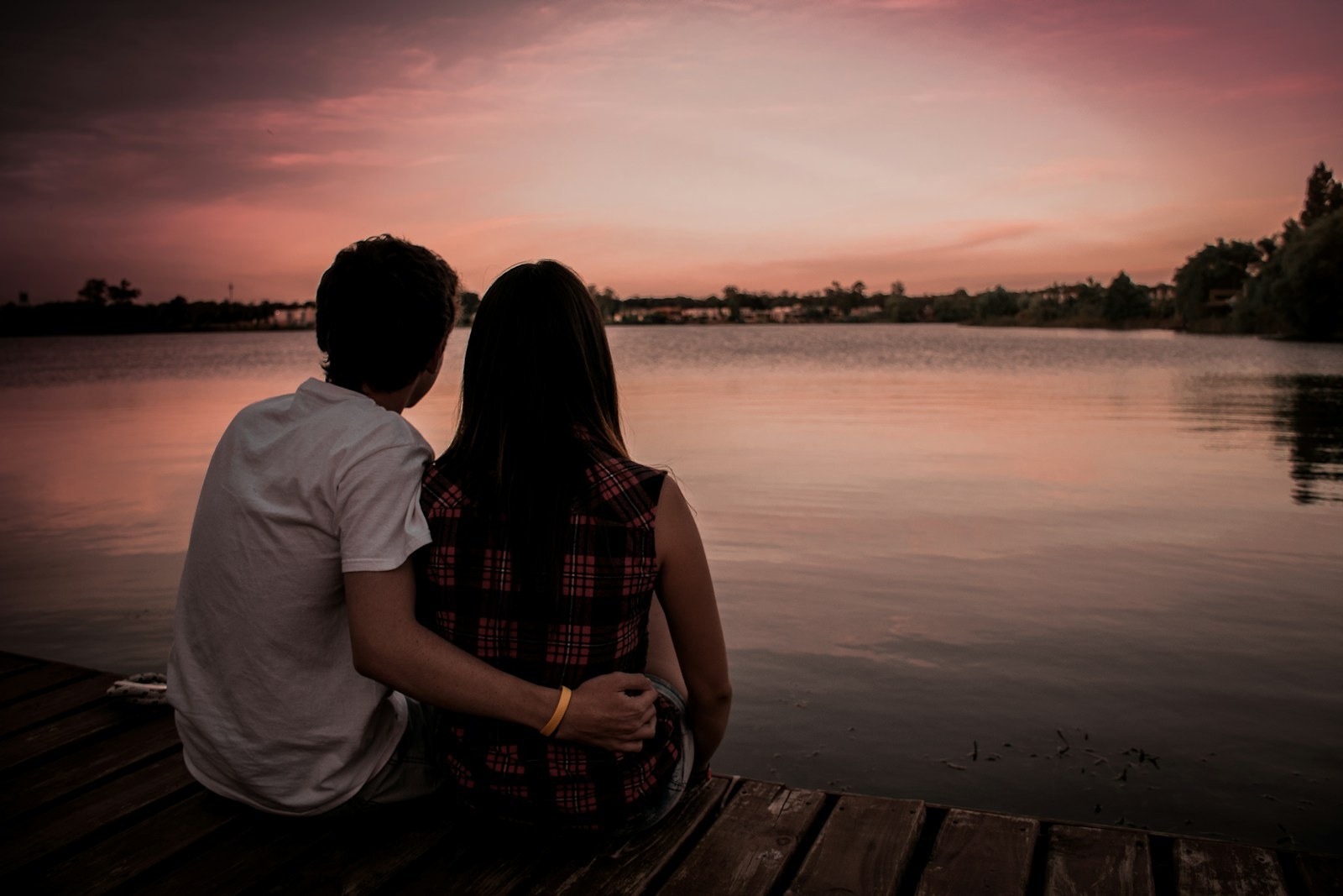 Couple sitting together while facing a difficult relationship choice