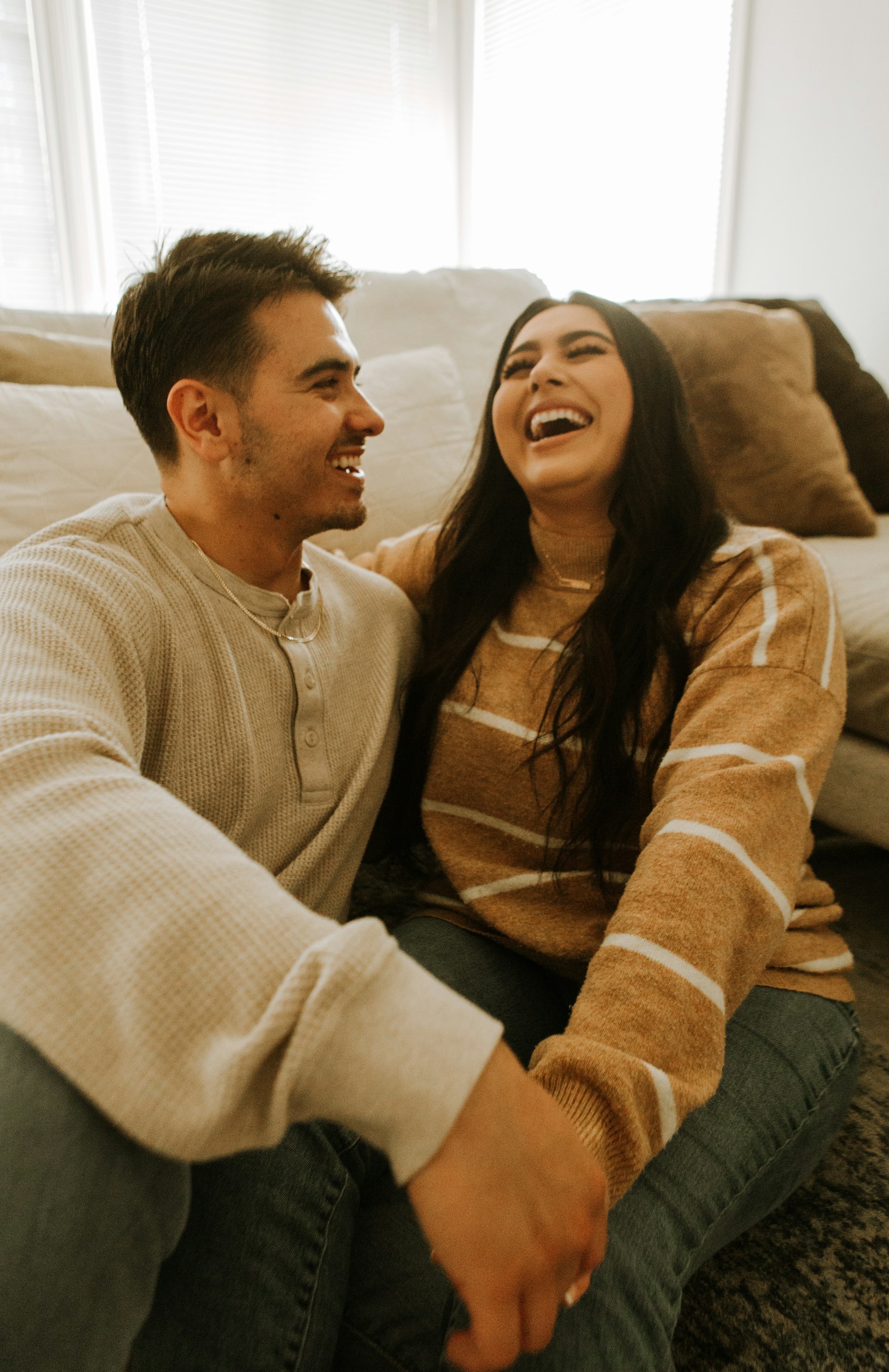 Married couple sharing a relaxed conversation while reconnecting at home