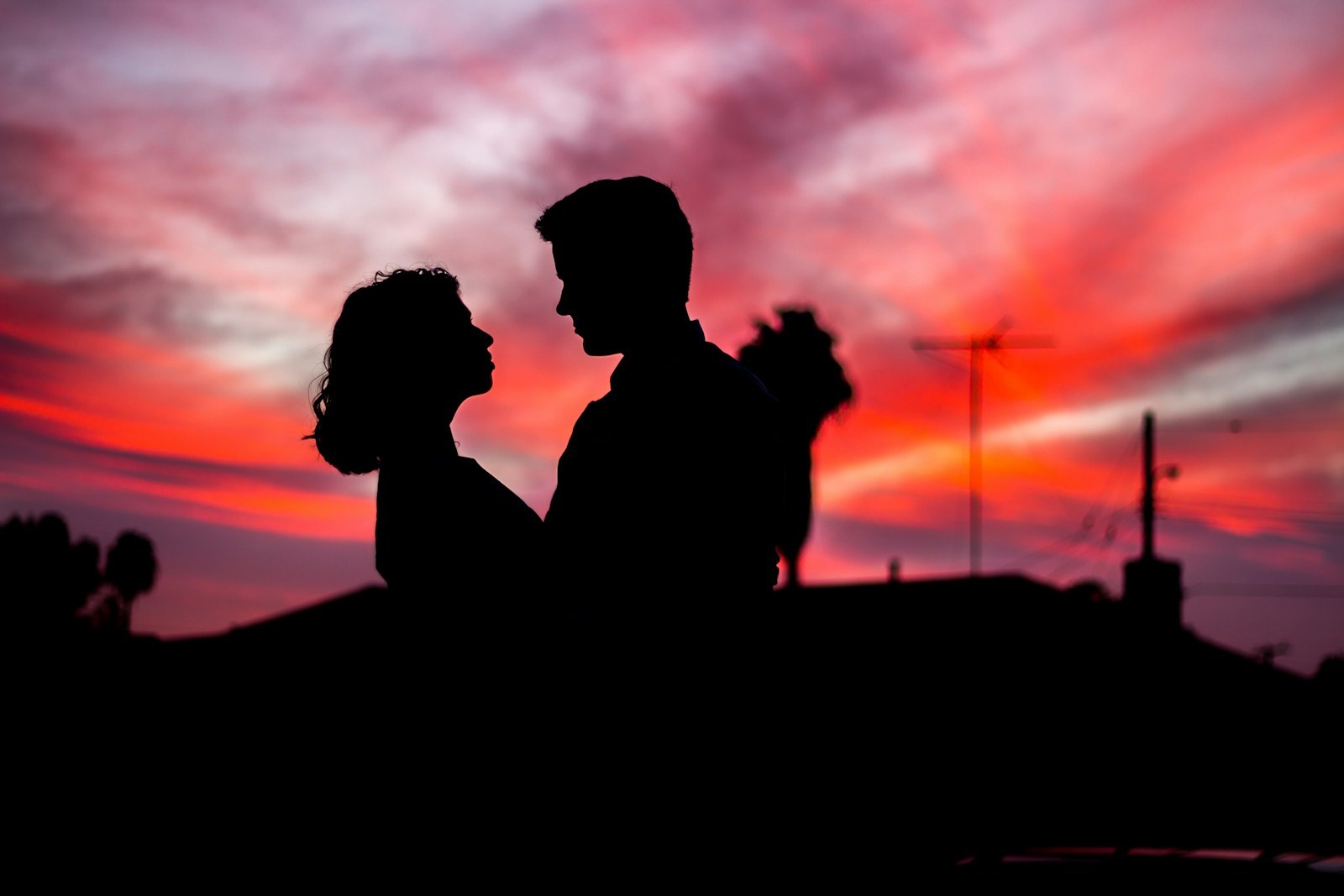 Two people facing each other while reflecting on complicated feelings