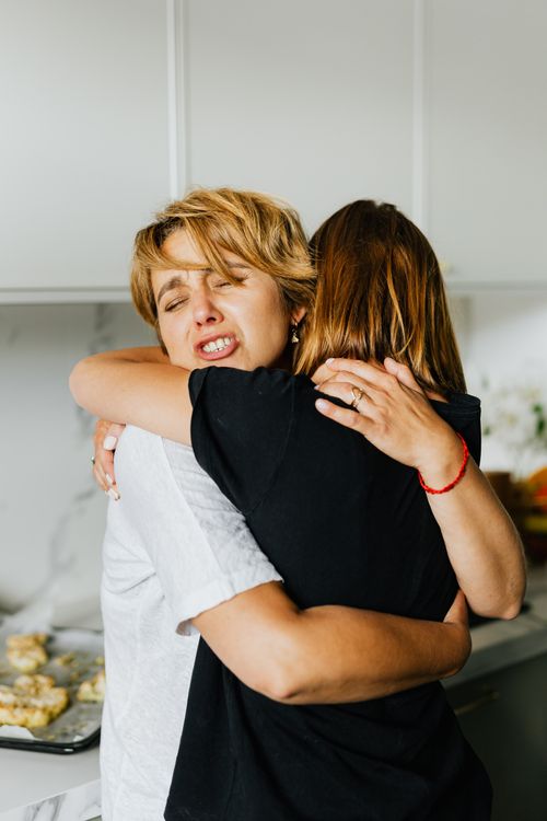 Couple hugging after an honest conversation about reassurance and trust