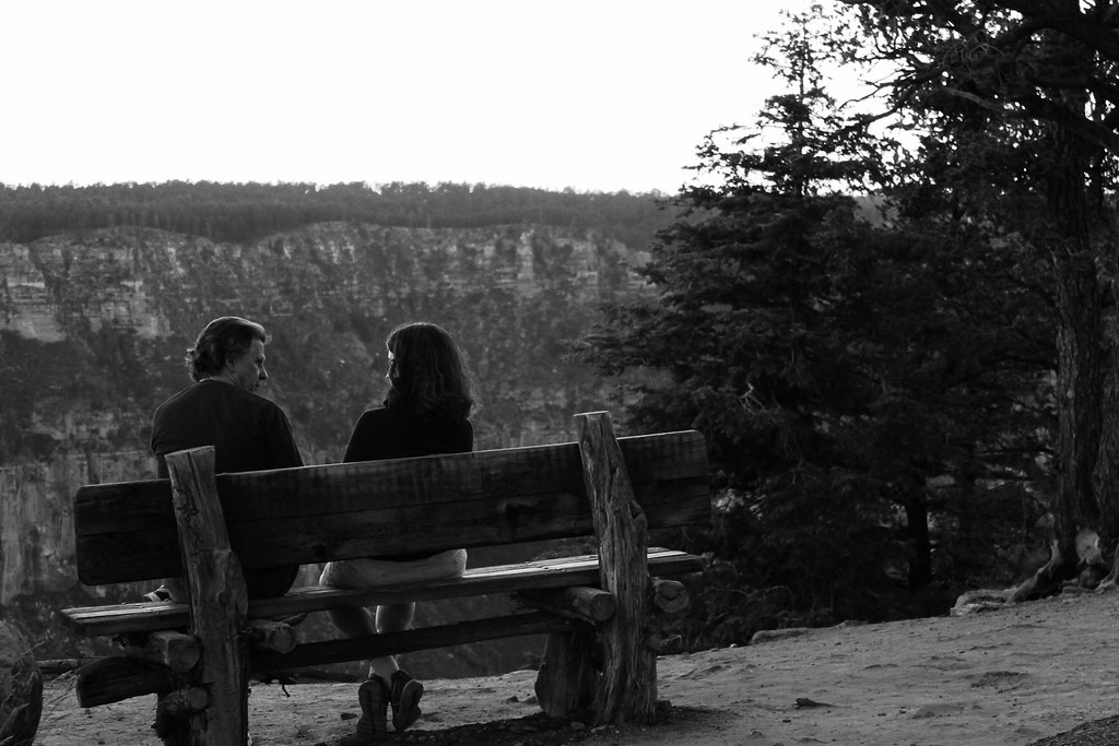 Couple sitting together in a quiet conversation, representing emotional distance after conflict