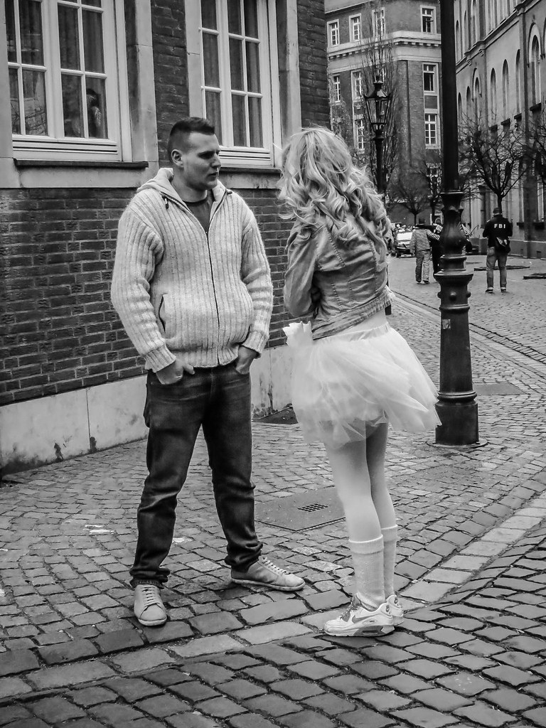 Couple having a hard conversation in public, illustrating conflict avoidance and emotional tension