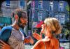 Couple in a tense face-to-face conversation outdoors, reflecting relationship conflict and emotional strain