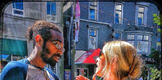 Couple in a tense face-to-face conversation outdoors, reflecting relationship conflict and emotional strain