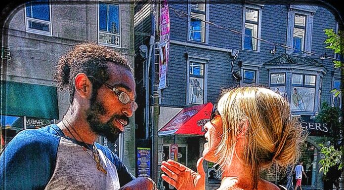 Couple in a tense face-to-face conversation outdoors, reflecting relationship conflict and emotional strain