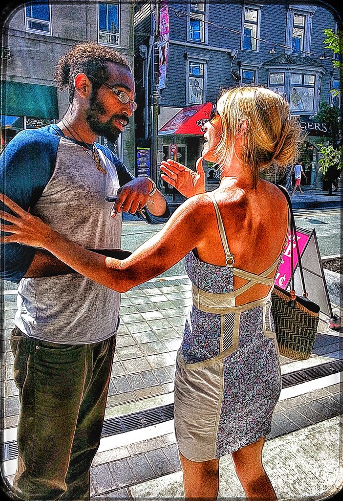 Couple in a tense face-to-face conversation outdoors, reflecting relationship conflict and emotional strain