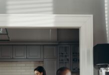 Couple spending quiet individual time together at home
