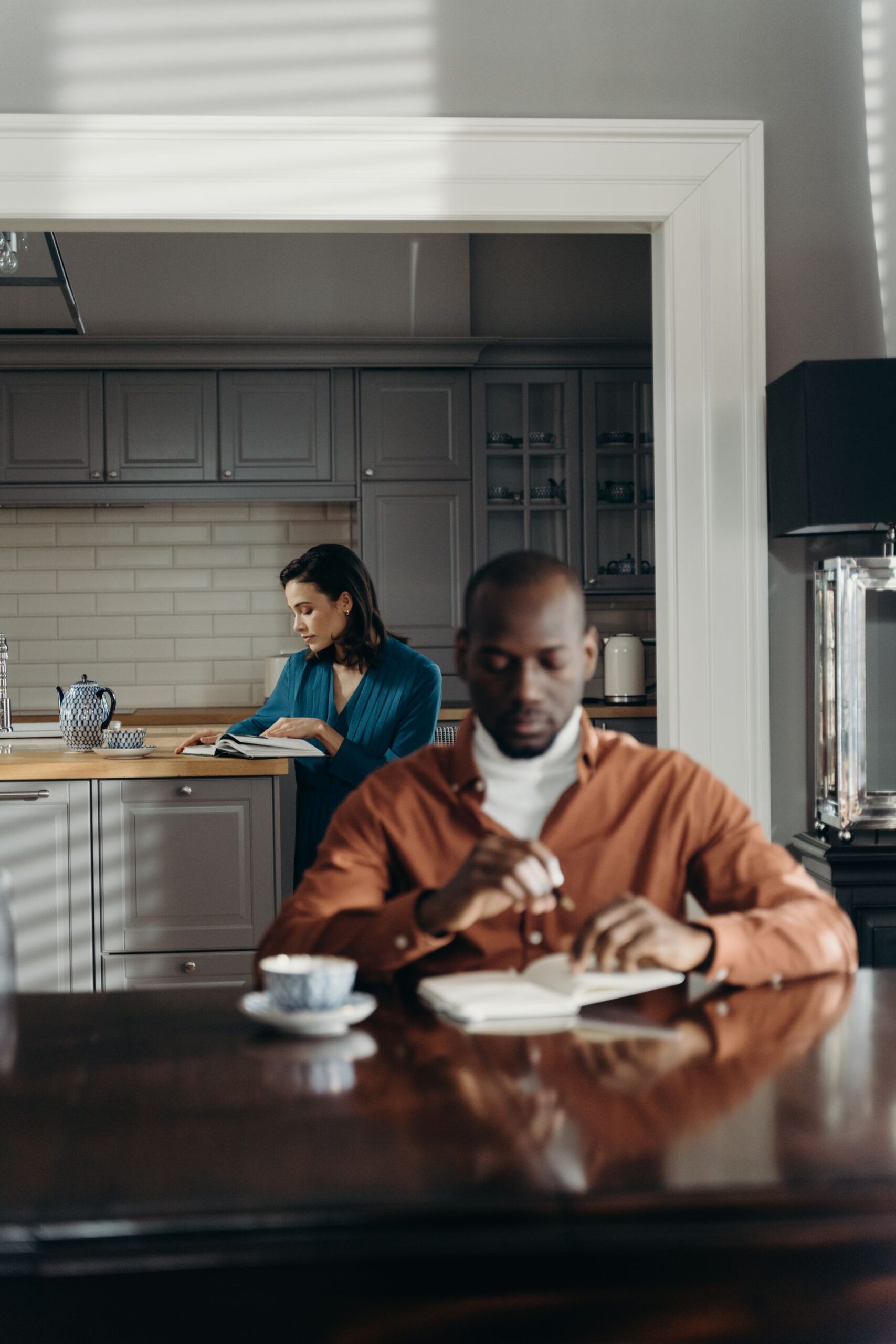 Couple spending quiet individual time together at home