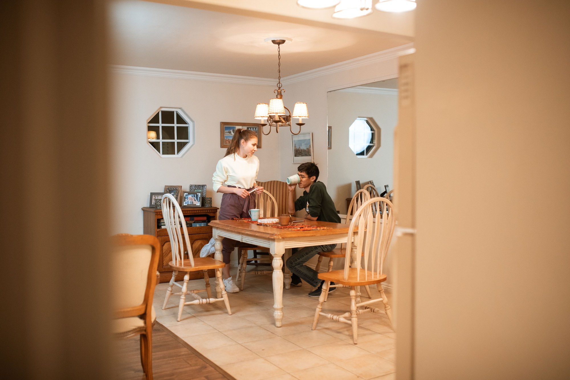 Couple calmly discussing chronic lateness at home
