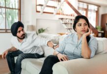 Couple discussing a competitive relationship pattern at home