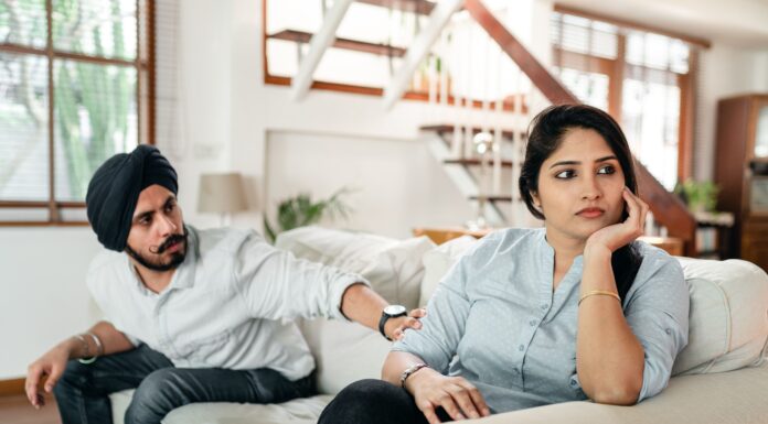 Couple discussing a competitive relationship pattern at home