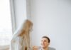 Couple discussing houseguest boundaries together at home
