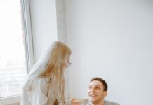Couple discussing houseguest boundaries together at home