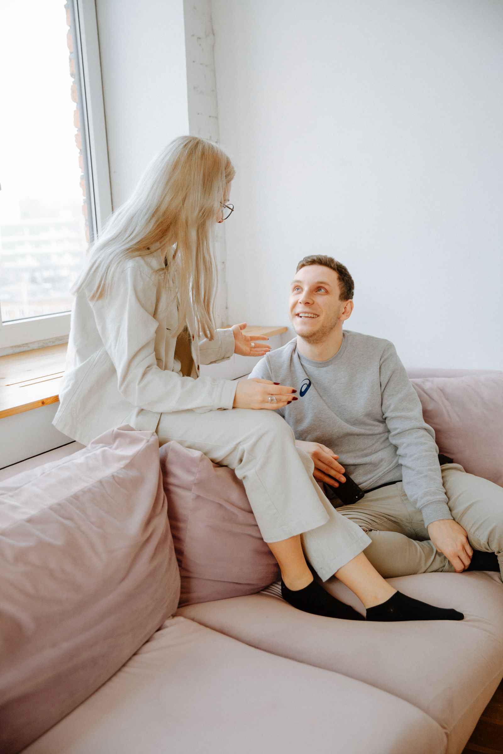 Couple discussing houseguest boundaries together at home
