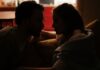 Couple discussing household lighting habits at home