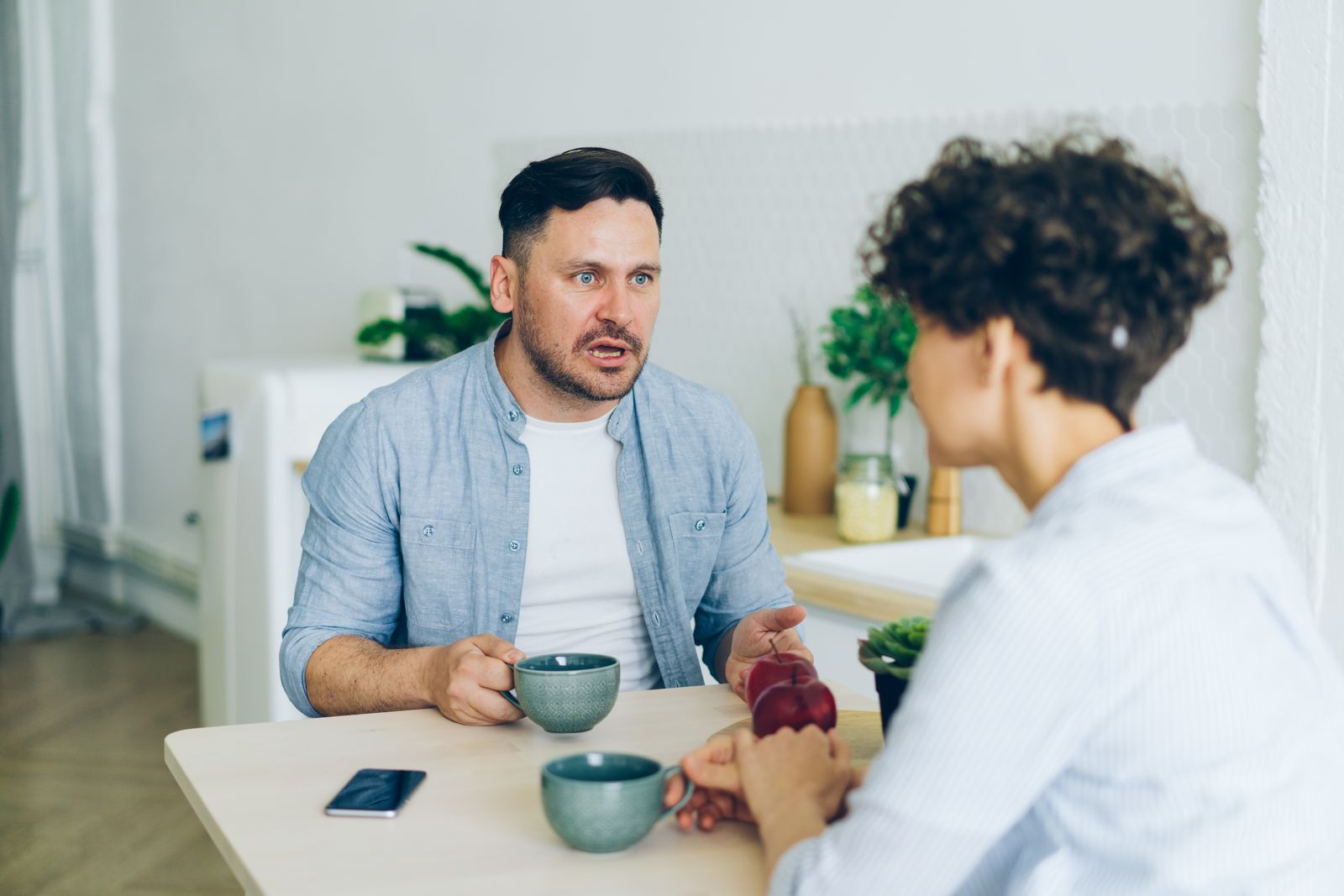 Couple having a serious conversation about whether to move