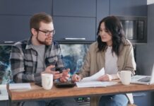 Couple discussing shared decisions at a kitchen table