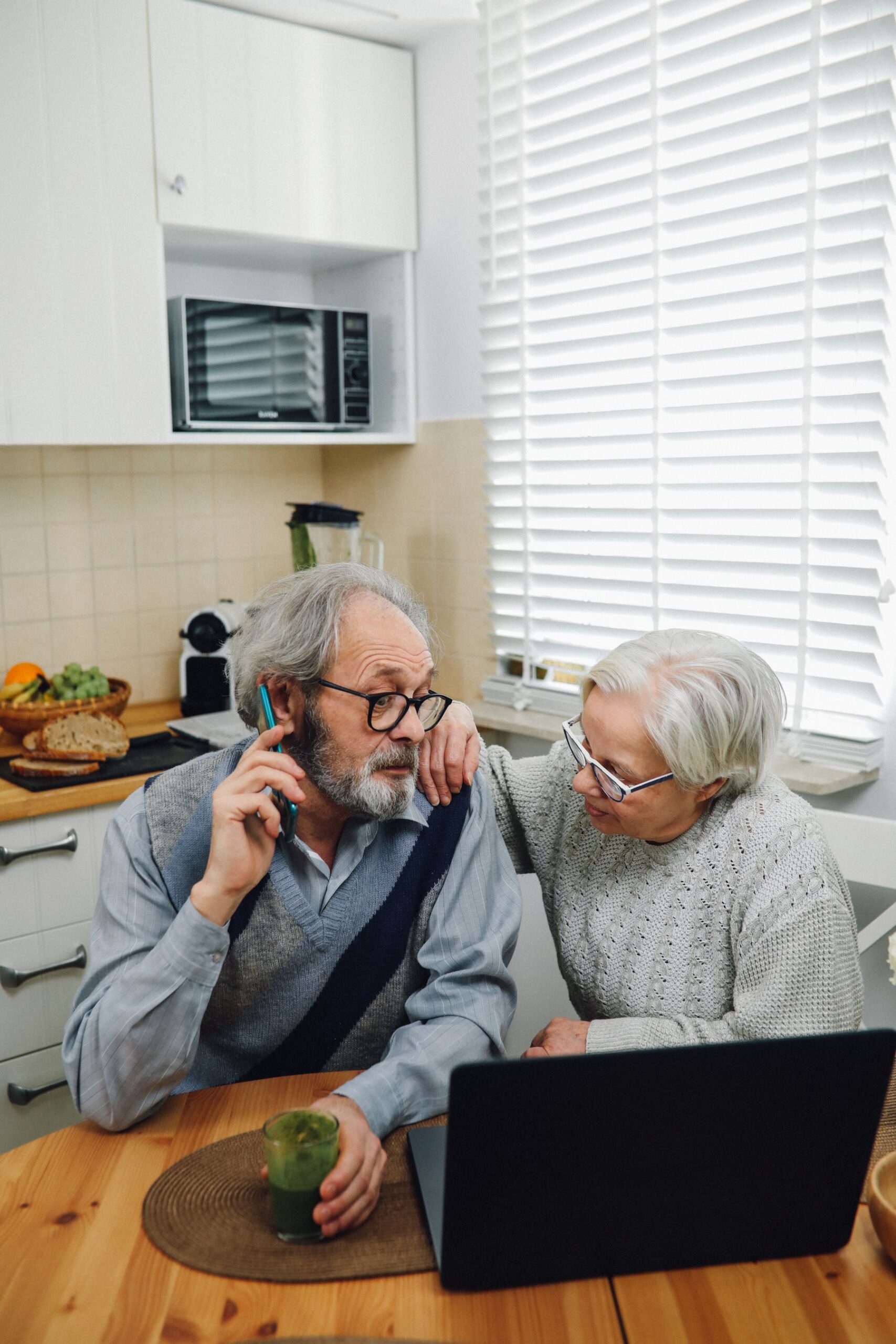 Older couple planning caregiving support together at home