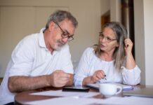 When Partners Want Different Retirements: How to Plan a Shared Future Without Giving Up Your Own Older couple reviewing plans for their different retirement goals
