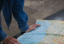 Couple planning a road trip together with a map