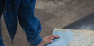 Couple planning a road trip together with a map