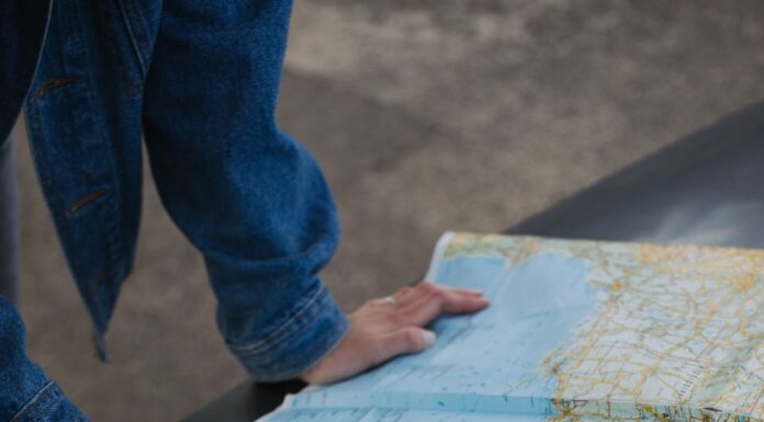 Couple planning a road trip together with a map