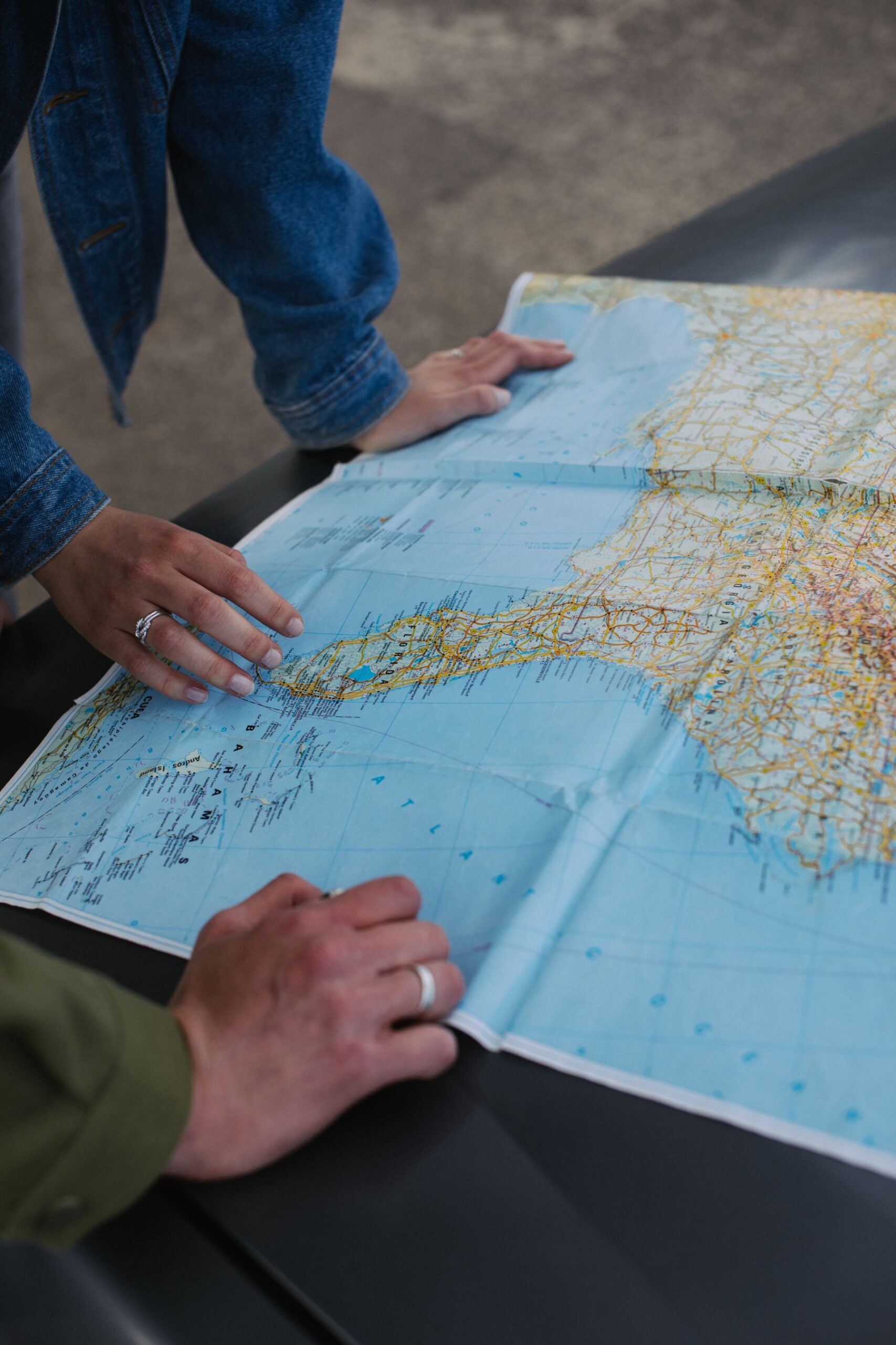 Couple planning a road trip together with a map