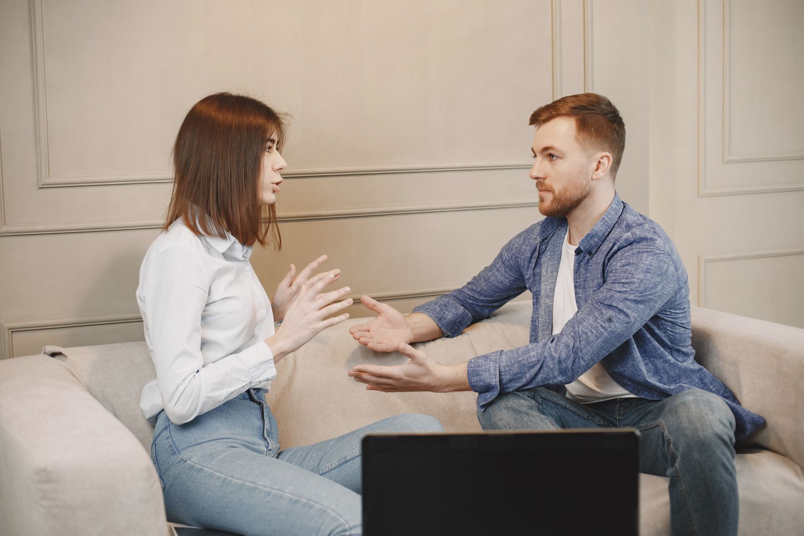 Couple setting digital privacy boundaries during a calm conversation