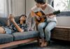 Couple sharing a music hobby together at home