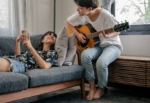 Couple sharing a music hobby together at home