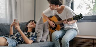 Couple sharing a music hobby together at home