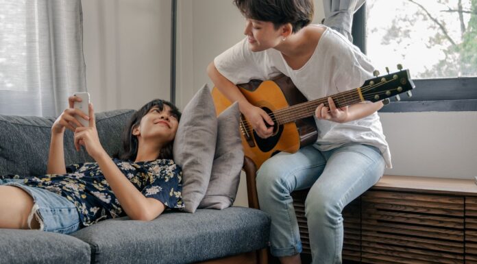 Couple sharing a music hobby together at home