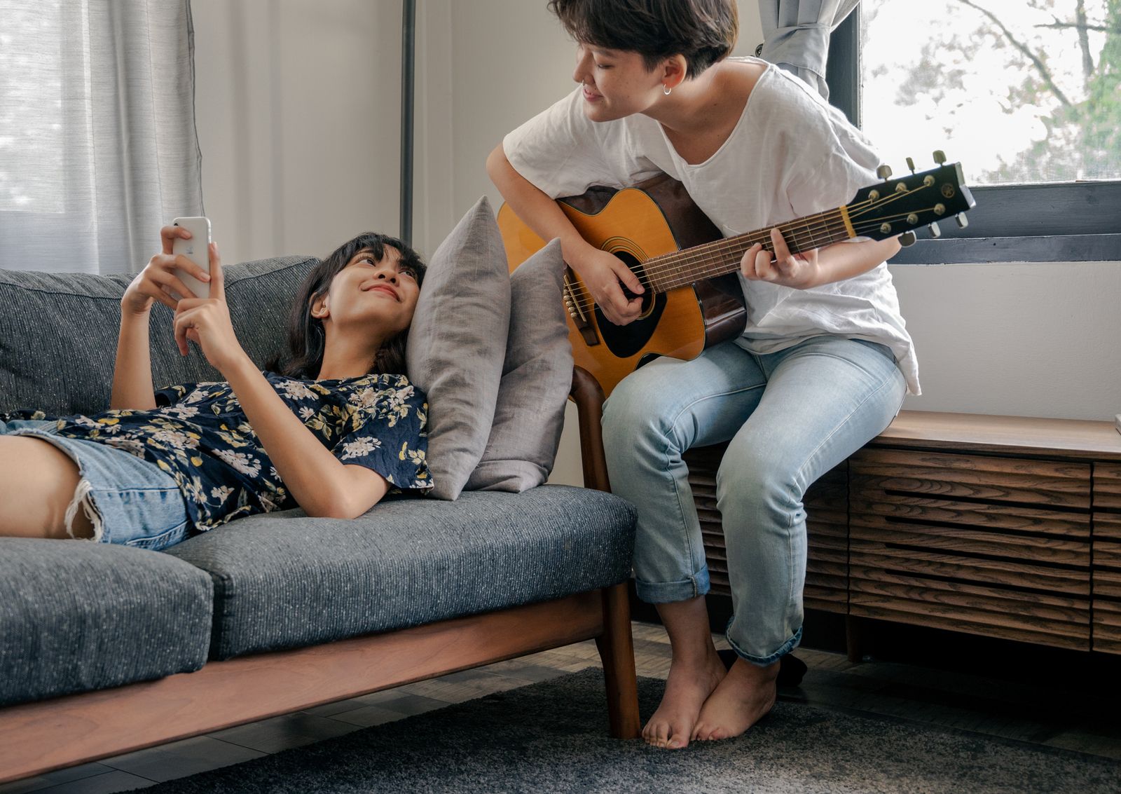 Couple sharing a music hobby together at home