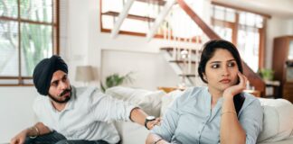 Couple talking about repeated canceled plans at home