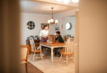 Couple talking together at the dining table after a workday