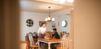 Couple talking together at the dining table after a workday