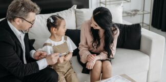 Parents talking with their child during a calm family conversation