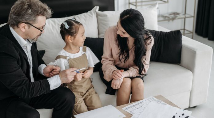 Parents talking with their child during a calm family conversation