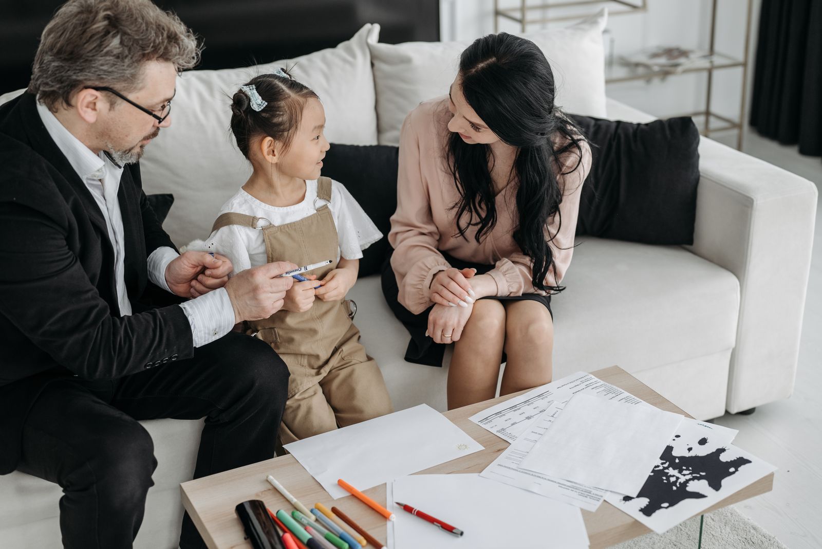 Parents talking with their child during a calm family conversation